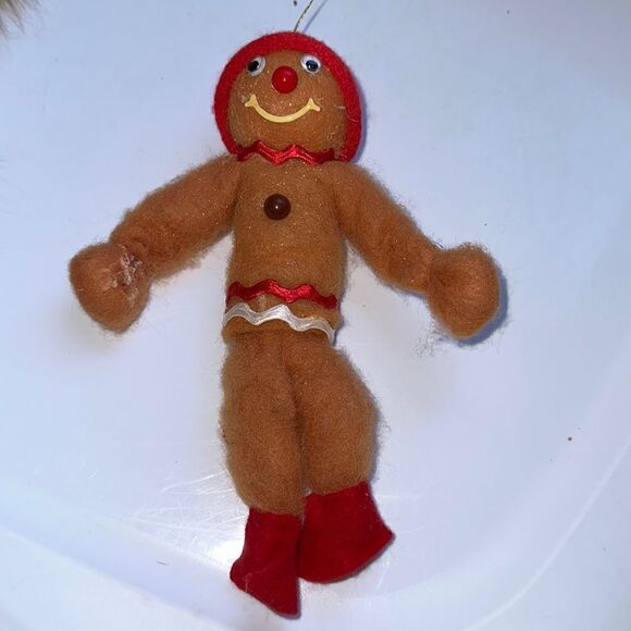 Vintage bendable smiling fuzzy gingerbread man ornament with red cap - Picture 7 of 10